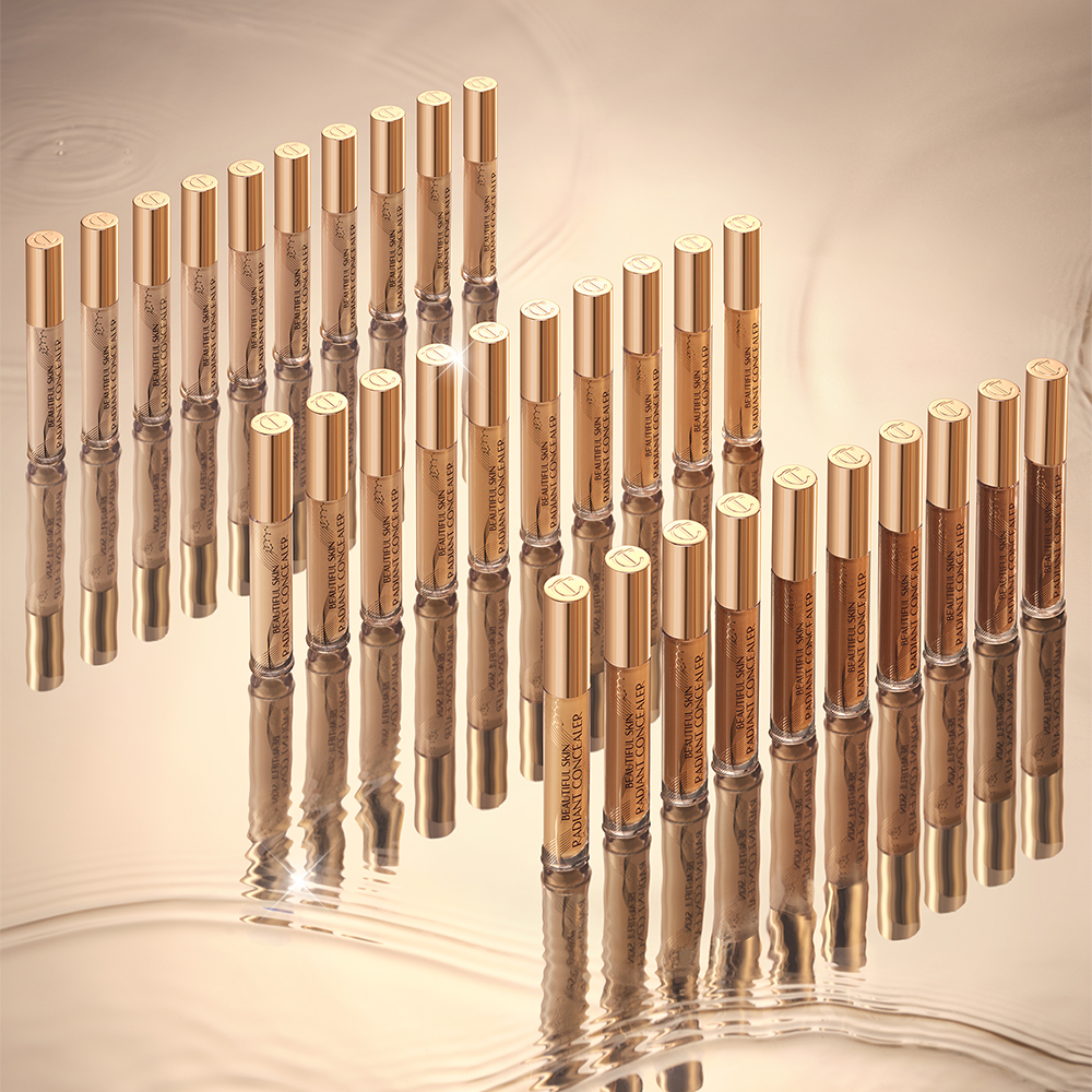 A collection of creamy concealers with a radiant, glowy finish in glass tubes with gold-coloured lids for skin tones of all types.