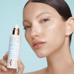 MODEL HOLDING CHARLOTTE'S MAGIC HYDRATOR MIST