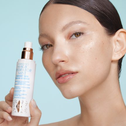 MODEL HOLDING CHARLOTTE'S MAGIC HYDRATOR MIST
