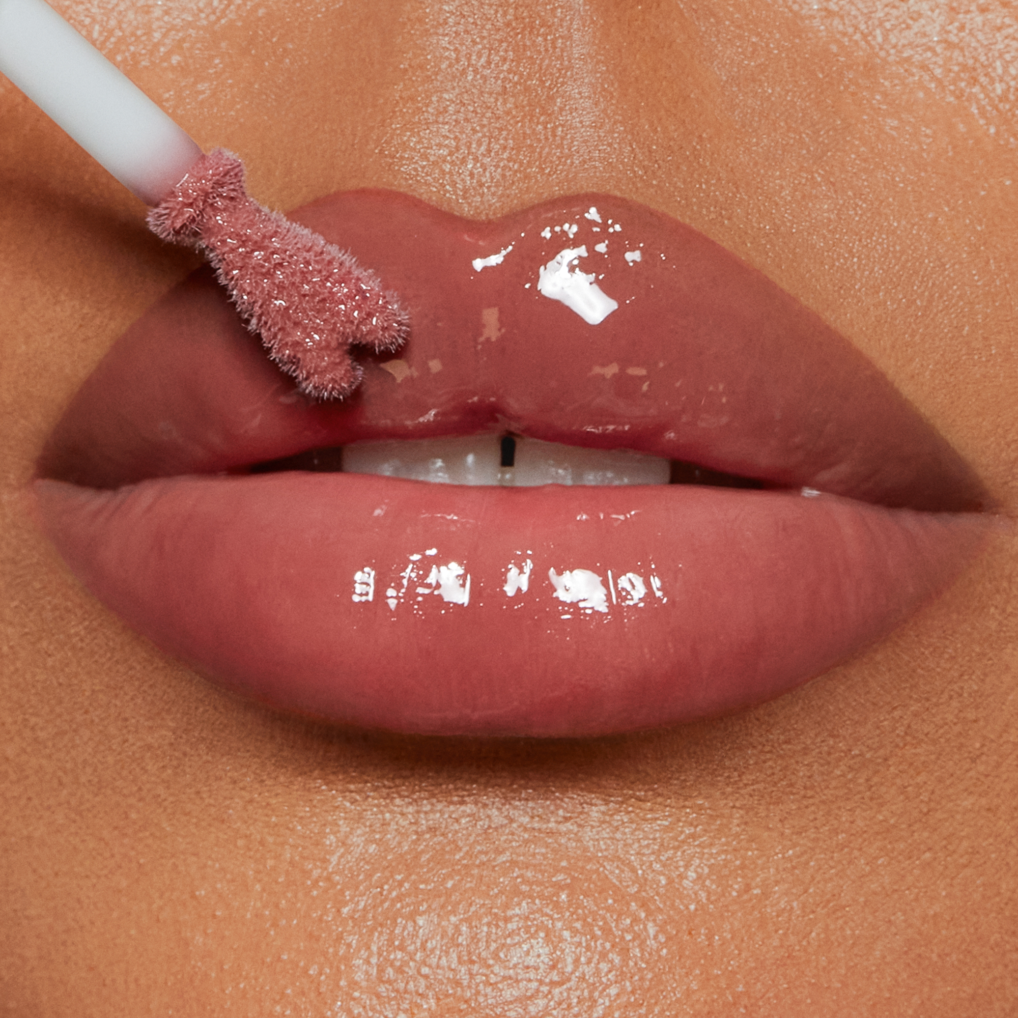Collagen Lip Bath - Pillow Talk Medium on medium skin tone model