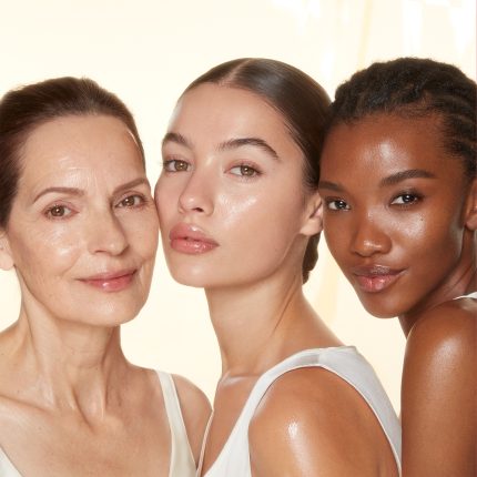 Three models wearing Charlotte Tilbury skincare