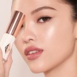 Model wearing Unreal Skin Foundation Stick