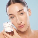 Bella Tilbury holding Charlotte's Magic Water Cream gel moisturiser