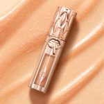Lip gloss with gold packaging and gold sparkly fill.