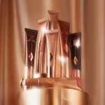 Hollywood Contour Wand Easy Liquid Contour against gold curtain