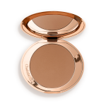 An open mirrored-lid bronzer compact in a medium-brown shade.