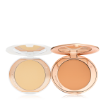 Two, open, setting powder compacts with mirrored-lids and white and gold-coloured packaging, in banana yellow and clay-brown shades.