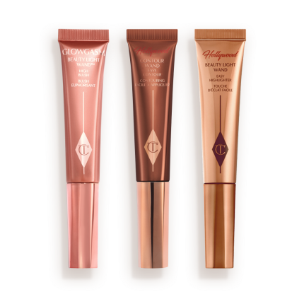 Medium-pink liquid blush wand, glowy brown contour wand, and soft candlelight-gold-coloured liquid highlighter wand.