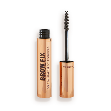 An open tube of clear, brow fixing gel with gold-coloured packaging.