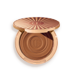 Open, cream bronzer compact in a medium-brown shade with gold-coloured packaging.