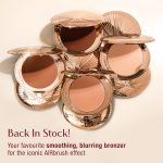 Five open compacts of Charlotte Tilbury bronzer with rose gold packaging, arranged in a circular pattern. Text reads 'Back In Stock! Your favourite smoothing, blurring bronzer for the iconic AIRbrush effect.