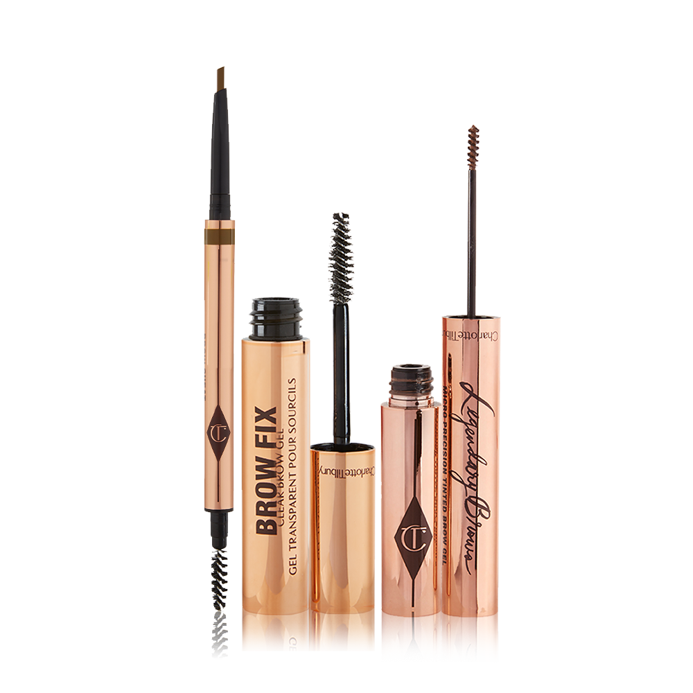 Brow-Bundle-3-Packshot An open, double-ended eyebrow pen and brush, open eyebrow gel, and open eyebrow tint, all in gold-coloured tubes.