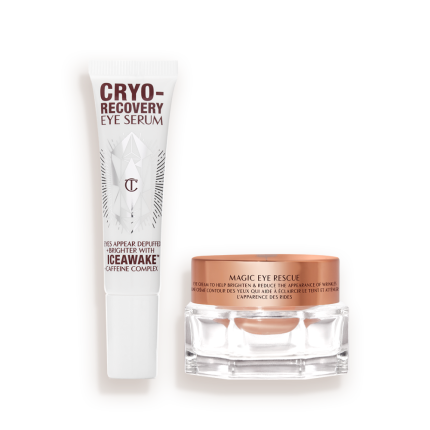 An open, white-coloured eye serum tube with silver-colour geometric patterns on the front and text written on it that reads, 'eye appear depuffed and brighter with Iceawake, caffeine complex' and an open, champagne-coloured thick, eye cream in a glass pot with a gold-coloured lid.
