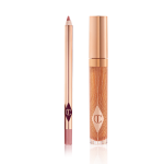 An open lip liner pencil in a nude pink shade and a closed, lip gloss in a sheer gold shade with a gold-coloured lid.