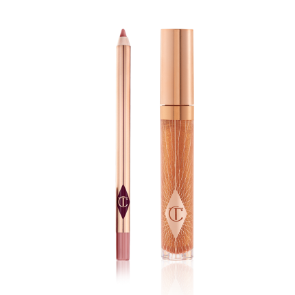 An open lip liner pencil in a nude pink shade and a closed, lip gloss in a sheer gold shade with a gold-coloured lid.