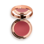 An open, mirrored-lid lip and cheek cream compact in a warm rosebud-pink shade.