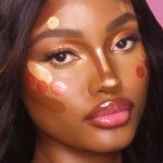 BEAUTY LIGHT WAND SWATCHED ON DEEP SKIN TONE MODEL