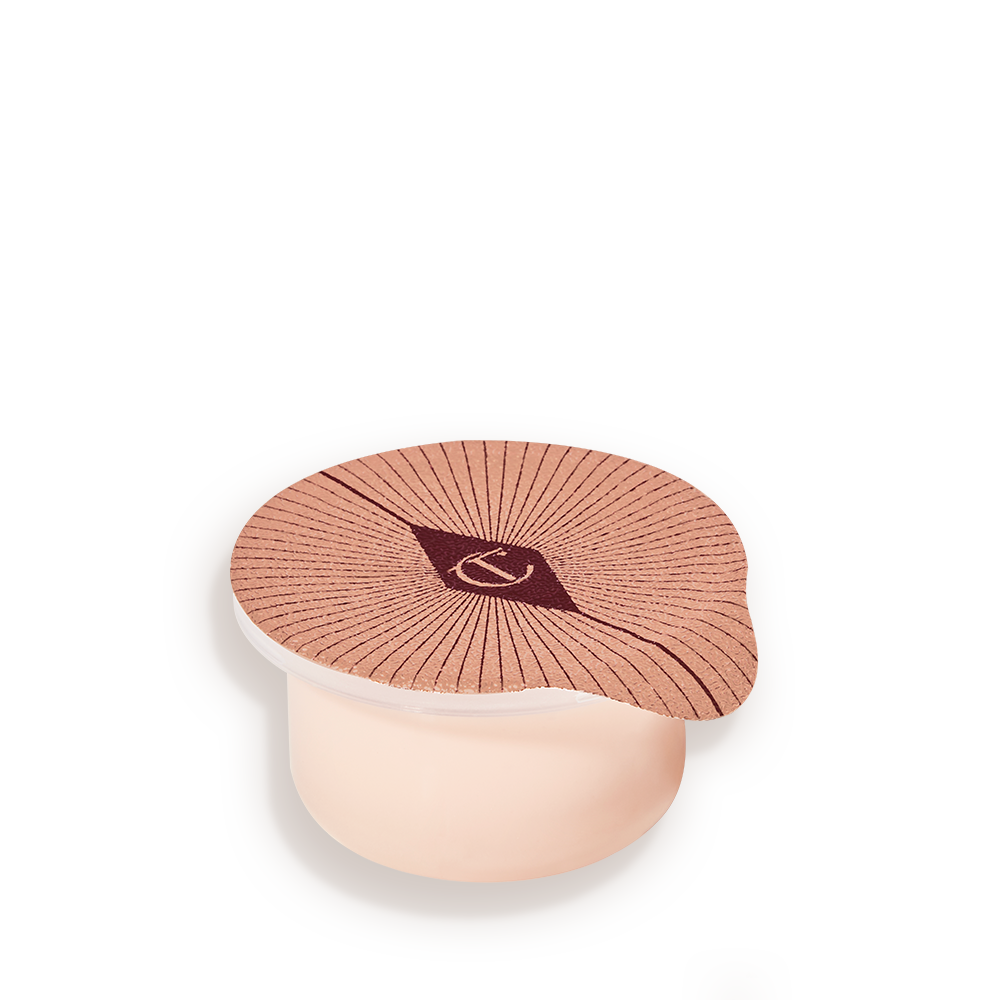 DROP-SHADOW-TEMPLATE__2_ Refill of a champagne-coloured, thick and luscious eye cream in a petite pot with an easy-to-peel-off cover.