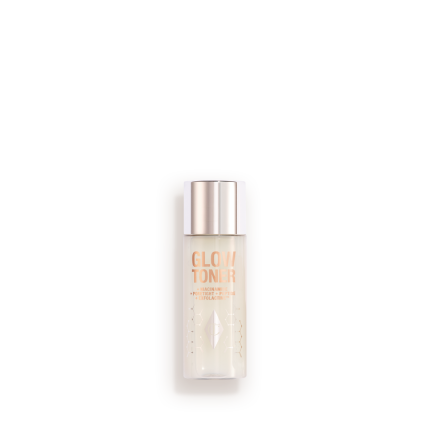A large, clear bottle filled with luminous, cream-coloured watery toner with a silver-coloured lid.