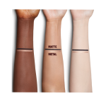 Fair, medium, and deep-tone arms with swatches of a duo eyeliner pencil in black and champagne-beige shades.