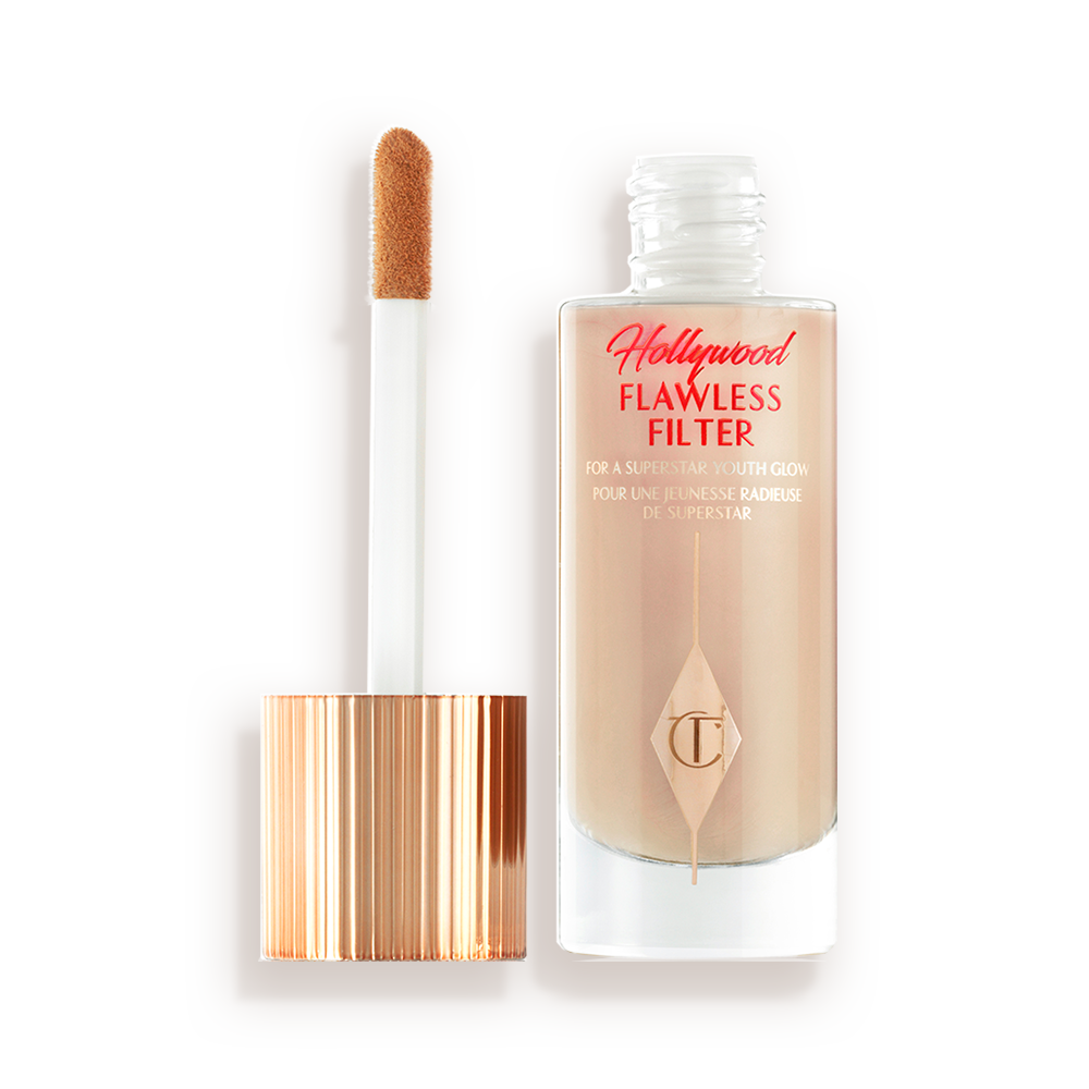 HFF-PACKSHOT-OPEN-4.5 An open, luminous primer in a light cool-toned-beige shade in a glass bottle with its gold and white doe-foot applicator next to it.
