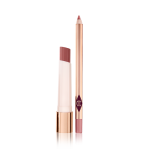 An open, moisturising lipstick lip balm in a nude pink shade with an open lip liner pencil in nude pink.