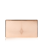 A closed duo contour palette with a light gold-coloured lid with a starburst pattern on top in a darker shade of gold.