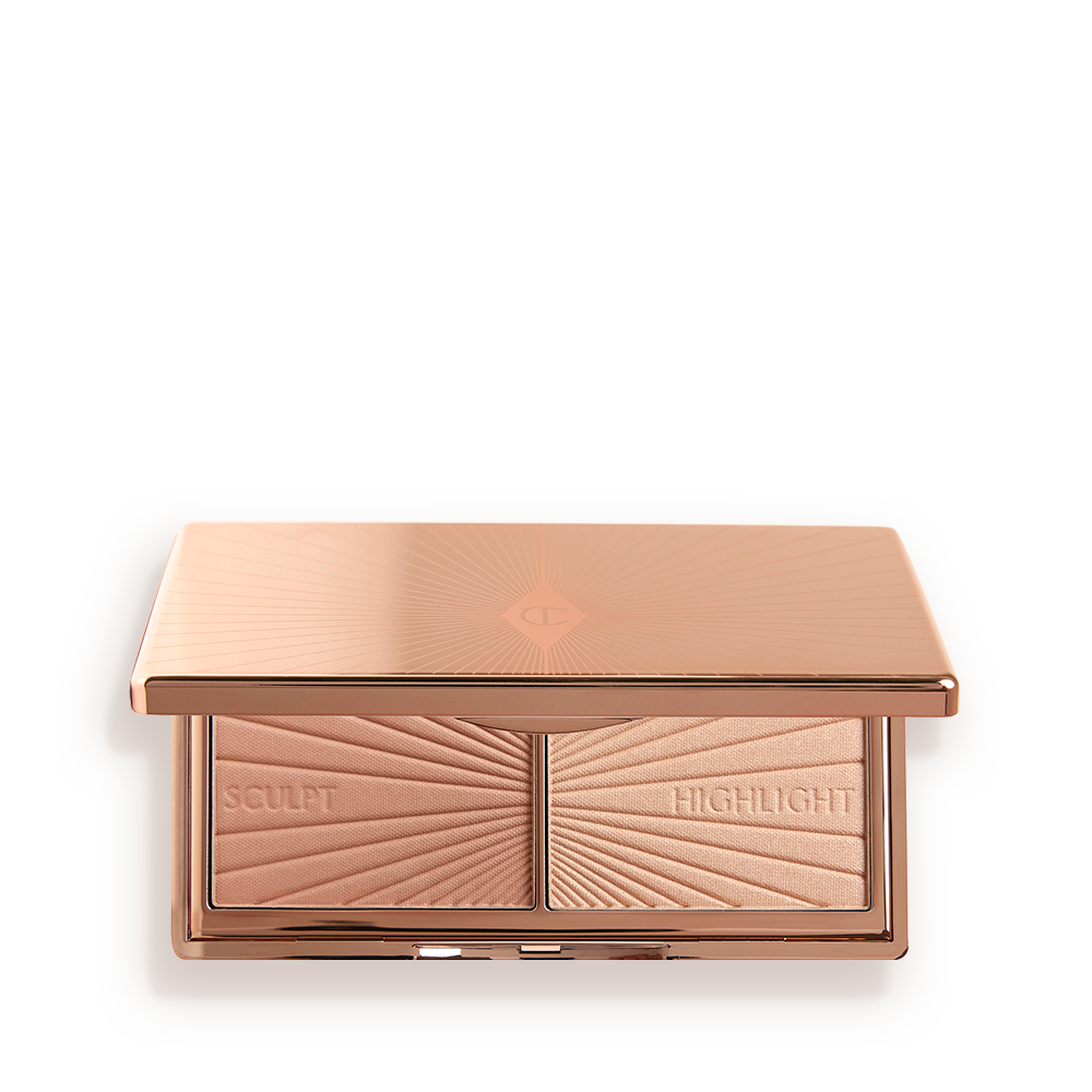 Holiday_packshots_TS_Filmstar_open_FRONT__1_ An open, mirrored-lid duo contour palette for light to medium skin tones in sleek rose-gold-coloured packaging.