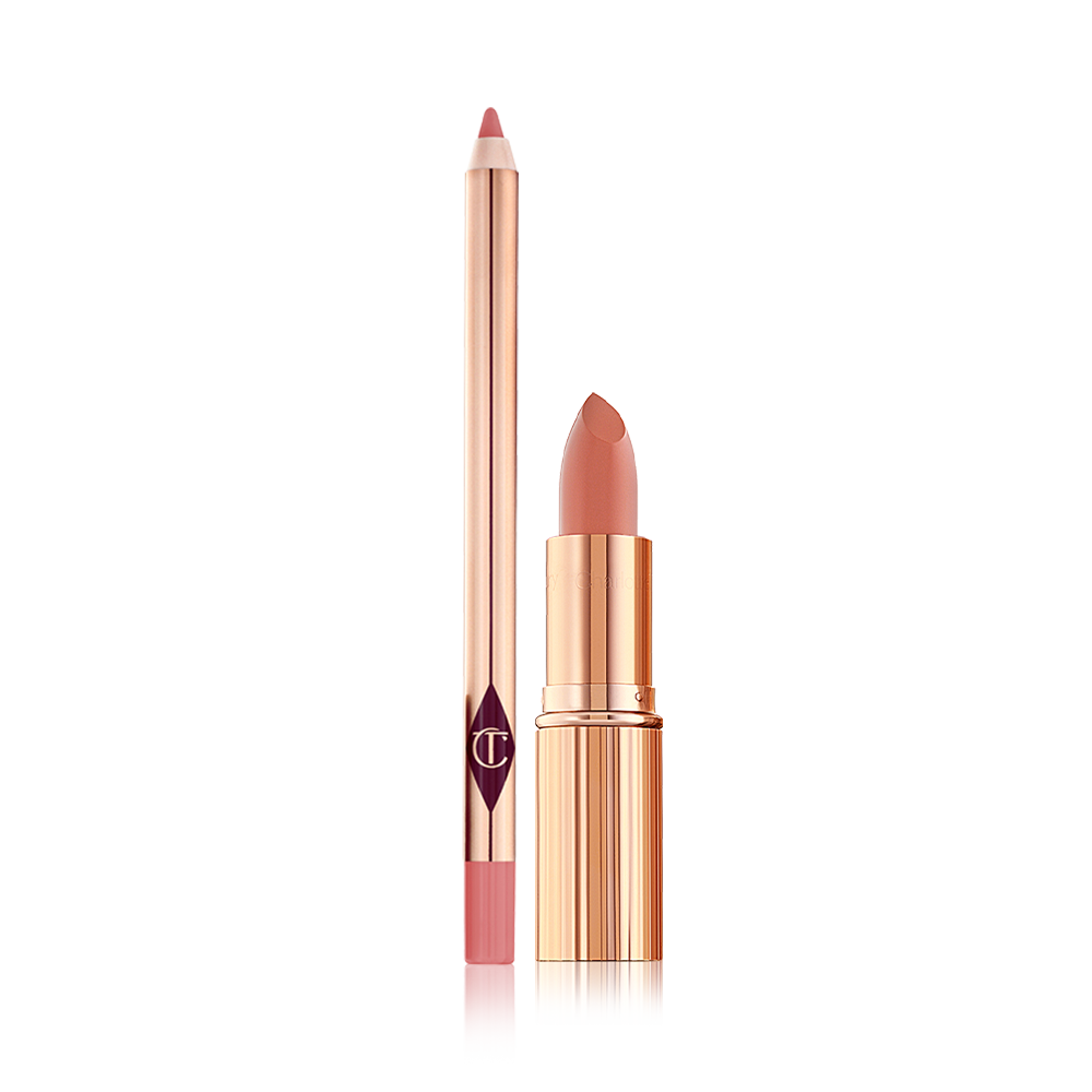 Kissing-Lip-Slick-Packshot An open lip liner pencil in a peachy-pink shade and an open lipstick in a salmon-pink colour in a gold-coloured tube.