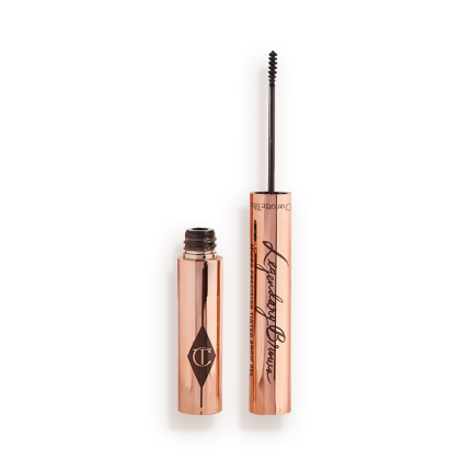 Open, tinted brow gel in a black-brown shade with a thin brush for precision, and a shiny, gold-coloured tube.
