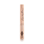 A closed tube of eyebrow gel in gold-coloured packaging.