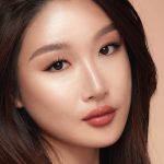 Model wearing Hollywood Contour Wand Easy Liquid Contour - Fair