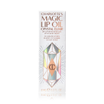 A white-coloured lip oil box with shiny, geometric patterns on it, and Magic Lip Oil written on it in rose gold colour.