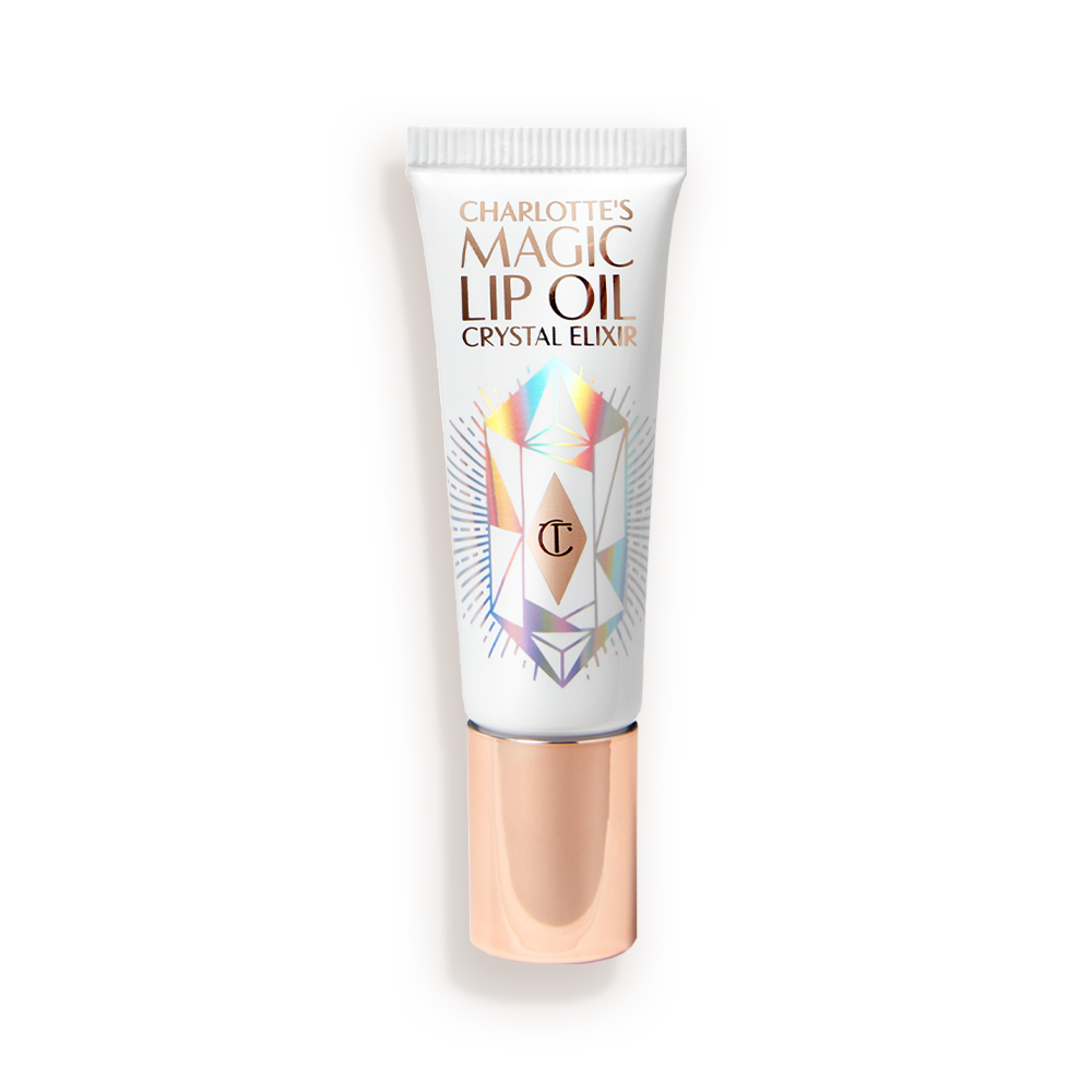 Lip-Oil-Closed-Packshot A lip oil in a white coloured tube with reflective geometric patterns on it in silver colour and a rose-gold-coloured lid.