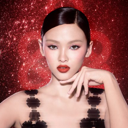 Model wearing the NEW! New Year Lipstick in Kiss of Fortune