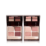 Two mirrored-lid quad eyeshadow palettes with matte and shimmery eyeshadows, one with rose gold and brown shades and the other with pink and brown shades, and both having a bright beige enhancing shade.