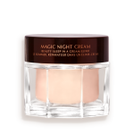 Award-wining, peach-coloured night cream in a large glass jar with a dark brown-coloured lid with Magic Night Cream written on it in gold colour.