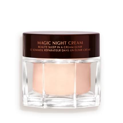 Award-wining, peach-coloured night cream in a large glass jar with a dark brown-coloured lid with Magic Night Cream written on it in gold colour.