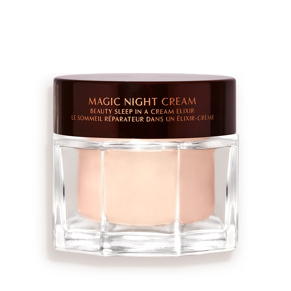 MAGIC-NIGHT-CREAM-50ML-PACKSHOT__1_ Award-wining, peach-coloured night cream in a large glass jar with a dark brown-coloured lid with Magic Night Cream written on it in gold colour.