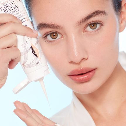 Model applying Charlotte's Magic Hydration Revival Cleanser