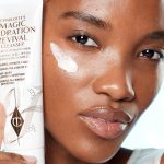 Model applying Charlotte's Magic Hydration Revival Cleanser