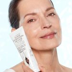 Model applying Charlotte's Magic Hydration Revival Cleanser