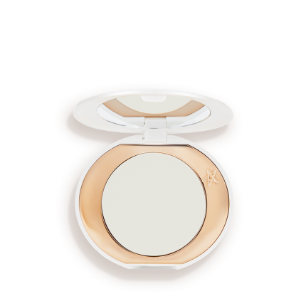 A miniature compact brightening powder in a white shade for fair and medium skin tones.
