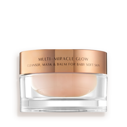A 3-in-1 face fawn-coloured cleanser, mask, and balm in a glass jar with gold-coloured lid.