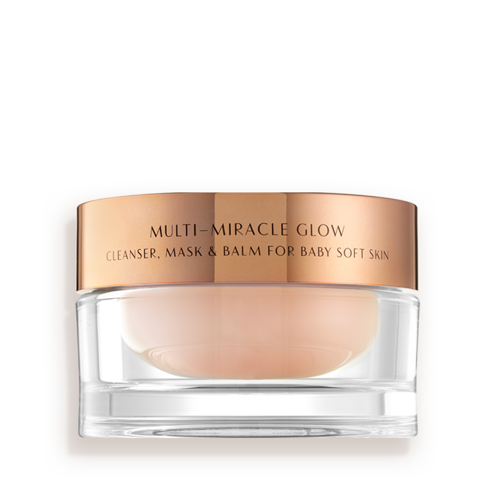 Multi_Miracle_Glow A 3-in-1 face fawn-coloured cleanser, mask, and balm in a glass jar with gold-coloured lid.