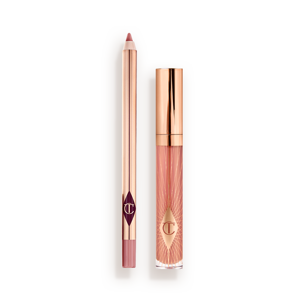 PILLOW_TALK_COLLAGEN_LIP_BATH_KIT A closed, nude-pink lip gloss with a rose gold lid with an open, nude-pink lip liner pencil with a rose gold body.