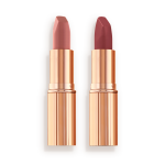 Two matte lipsticks, one a nude pink and the other a berry-rose shade in golden, metallic tubes with their lids removed.