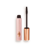 Mascara in a pink-coloured tube with its gold-coloured lid with a black applicator next to it.