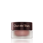 Cream eyeshadow in a glass pot in a nude pink shade with fine shimmer with a dark brown-coloured lid.