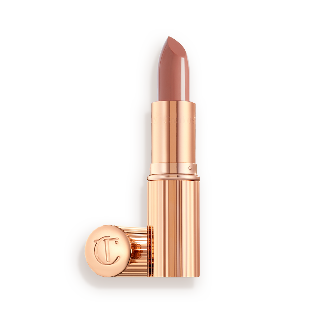 Runway-Royalty-3-Packshot two lipsticks, with and without lid, in soft rosy peach shade with a satin finish in sleek gold-coloured packaging.